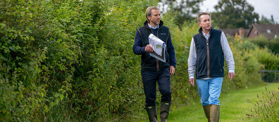 Land team walking with landowner